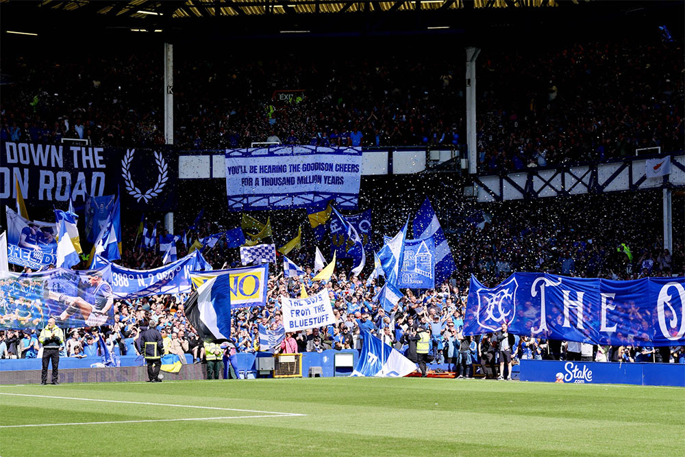 The Gwladys Street End festooned with flags and tifos ahead of the penultimate game at Goodison Park